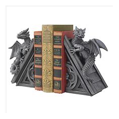 a bookend with two books and a dragon figurine