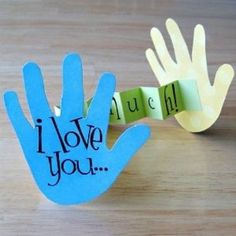 a hand made out of paper with the words i love you on it