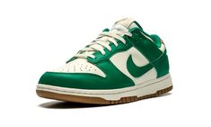 The Women’s Nike Dunk Low “Malachite” is a women’s-exclusive colorway of the classic basketball shoe with green details.  The “Malachite” Dunk Low is complete with a Sail leather base and Malachite leather overlays and Swoosh branding.  A classic “Nike” logo is embroidered on the Metallic Gold leather heel tab.  More “Nike” and Swoosh branding can be found on the tongue tag.  The Sail rubber midsole gives the shoe an aged look.  A gum rubber outsole finishes off the design.  Release date: Novemb Nike Dunk Low Malachite, Dunk Low Malachite, Low Dunks, Green Details, Sb Dunk Low, Stadium Goods, Sb Dunk, Nike Dunk Low, Dunk Low