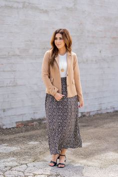 We cannot get over how stylish this skirt is! The floral print, button detailing, and flowy style fit makes such a cute, elegant look! Wear this skirt to any event and you are sure to receive compliments! We love tucking a blouse into this for a more elevated look or a basic or graphic tee for a casual feel!100% Polyester Chic Floral Print Maxi Skirt For Brunch, Chic Floral Print Midi Skirt, Elegant Floral Print Maxi Skirt For Brunch, Chic Floral Print Maxi Skirt For Day Out, Floral Print Skirt For Fall Day Out, Fall Floral Print Skirt For Day Out, Feminine Lined Maxi Skirt For Day Out, Modest Day Out Skirt With Lining, Modest Lined Skirt For Day Out