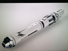 a silver and black fountain pen on a white surface