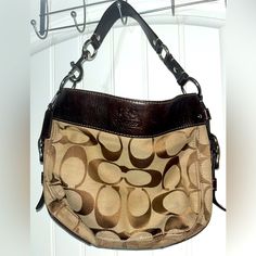 Vintage Coach Zoe Signature F12657 Jacquard Brown Hobo Handbag Used Vintage Coach Dark Brown Leather Handles Silver Hardware Signature Coach Design Color: Brown Type: Hobo Bag Embossed Coach Logo On Front Top Center. Exterior Needs Some Spot Cleaning I Don’t Have Time For That You Can Do If Buying Or Take To Someone To Do That. Hobo Is In Good Condition Considering Its Age. Lilac Interior Lining Very Clean. (See Photos) Edges Look Great For Its Age. Please Review All Photos Before Buying Serious Brown Coach Canvas Bag, Coach Canvas Bag With Leather Trim, Lilac Interior, Vintage Coach Bags, Hobo Handbag, Coach Logo, Zipper Top, Vintage Coach, Hobo Handbags