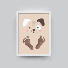 a framed print with a dog's paw and foot prints on the bottom half of it