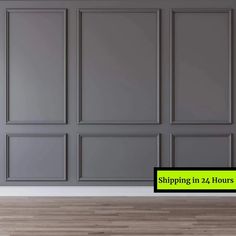 an empty room with gray walls and wood flooring in 24 hours or less is shown