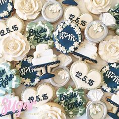 wedding cookies are arranged in the shape of hearts and flowers, with names on them