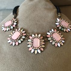 Blush, Pearl & Rhinestone Flowers Attached To Smooth, Twisted, Black Cord. Connection To Flowers & Chain Extender Brass Toned Patinaed. Never Worn. Still In Packaging. Elegant Pink Crystal Necklace For Party, Pink Crystal Rhinestone Necklace With Sparkling Stones, Pink Rhinestone Jeweled Necklace For Parties, Elegant Pink Rhinestone Necklace With Sparkling Stones, Pink Choker Necklace For Party, Pink Crystal Necklace With Rhinestones, Pink Rhinestone Necklace For Party, Elegant Pink Beaded Choker Necklace, Adjustable Pink Necklace With Stones