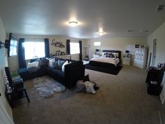 a living room filled with furniture and lots of pillows on top of the couches