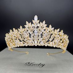 Transform into a dazzler on your special day with our elegant Tiara Crown. Perfect for brides and quinceañeras, this fashionable crown adds just the right amount of glamour without being overwhelming. Complete your look with this tasteful and exclusive accessory. High Quality Teardrop, Marquise and Round CZ gems. Measures 2 1/4 inches central height tapering to 1 inch to the sides Handcrafted with highest quality Zirconia jewels and rhodium plated to prevent tarnish and scratch. Ideal for Wedding, Bridal Hair, Anniversary, Quinceanera, Prom, Pageant and Special Occasions. Each Lucky Collections ™ tiara comes in custom luxury box for convenient presentation and keepsake. Loops on both ends of the Headpiece for stability and security Fast and Free Shipping from Los Angeles, California. Quinceanera Crowns Tiaras, Quinceanera Crowns, Quinceanera Flowers, Quince Jewelry, Quince Crowns, Dream Quinceanera, Elegant Tiara, Rose Gold Quince, Crown For Wedding