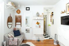 a living room filled with furniture and a flat screen tv