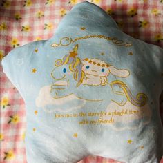 a blue pillow with an image of a unicorn on it