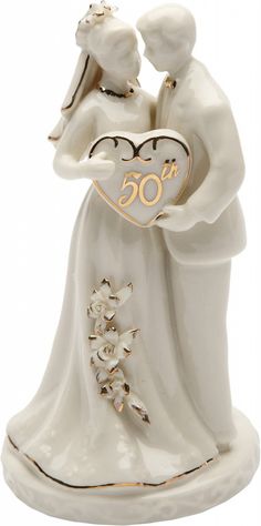 a figurine of a couple holding each other with the number 50 on it