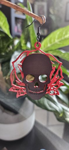 These earrings are printed with PLA filament, Which is a light weight plastic but also is rigid as well.  We use high-quality nickel free & lead free, safe and durable Earring Hooks. One side has a black skull with a Red Rose surrounding it and the other is all black. Earrings are 56mm tall by 49mm wide. Each pair of earrings are printed and assembled in Castle Rock, Colorado and are ready to ship in 5-7 business days (Often Sooner)! Product shipped may have slight variations due to the printing Castle Rock Colorado, Earrings Halloween, Black Skull, Castle Rock, Black Skulls, Skull Earrings, Halloween Earrings, Earrings Unique, Black Earrings