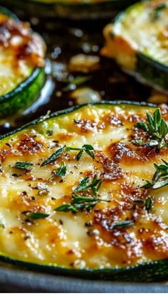 baked zucchini with cheese and herbs in a pan