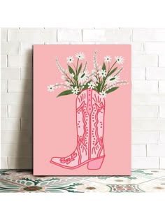 a pink poster with white flowers in a cowboy boot