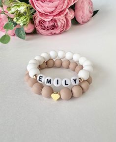 Beautiful Personalized Colorful Silicone Bracelets Made of: - silicone 9mm beads  - 18K Gold plated beads  - letter beads 6mm flat round acrylic  IS THIS A GIFT? Don't forget to leave your personal message in NOTE when checkout. It will be printed and added to your order in small beautiful envelope. NOTE: Beads are small and can present a choking hazard for children under the age of 3. Please monitor your child to prevent them from putting the bracelet in their mouth. Ships within 24 hours. Made White Heart Beaded Bracelets For Birthday, White Beaded Bracelets With Heart Beads For Birthday, White Stretch Bracelet With Heart Beads For Birthday, Name Bracelet Ideas, White Stretch Bracelet With 8mm Beads For Birthday, Adjustable Silicone Bracelet As Gift, Adjustable Silicone Bracelet For Gifts, Adjustable Silicone Bracelet For Gift, Girls Personalized Gifts