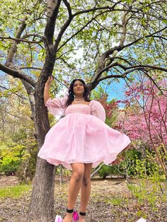 Pink Organza Babydoll Dress This is the babydoll dress for a dramatic, pink-loving princess. It's made entirely of high-quality sheer organza fabric, which makes it the puffiest, most dramatic babydoll dress in all of our collections! The skirt is made of three layers and the top is double-layered. Both the sleeves and top maintain their sheerness. All of the seams are inside the layers to prevent fraying and itchiness. The elastic at the bottom of the sleeve creates a ruffle effect at the elbow. It closes at the back with an invisible zipper. Model is 5'2" wearing a size small. Pink Barbiecore Dress With Ruffles, Pink Tutu Dress For Prom In Spring, Pink Princesscore Fairy Dress For Spring, Spring Princesscore Mini Dress With Ruffles, Balletcore Puff Sleeve Party Dress, Spring Mini Dress With Ruffles In Princesscore Style, Pink Puff Sleeve Tulle Dress, Pink Ruffled Dress With Bubble Hem, Pink Organza Fairy Dress For Wedding