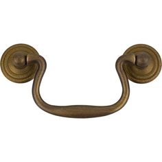 an antique brass door handle on a white background