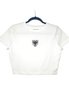 White crop top with image of Albanian double headed eagle in black.  Albanian Gifts | Albanian Women | Women's crop tops Eagle Albania, Albanian Shirt, Albanian Women, Albanian Eagle, Crop Top Blanc, Double Headed Eagle, White Crop, White Crop Top, White Tee