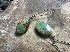 "A rustic pair of handmade, smooth variegated jasper stones, dangling from brass ear wires to 2 1/2\" (pictured) or 1 1/2\". No pair of earrings is a like, due to the nature of the stone. All jewelry is artfully gift wrapped in a jewelry box especially for you!" Dangle Jasper Earrings With Ear Wire, Natural Stone Earrings, Hippy Gifts, Green Jasper, Jasper Earrings, Gold Clips, Jasper Stone, Green Gemstones, Etsy Earrings Dangle