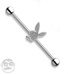 a piercing bar with a butterfly on it's end and an eyeball in the middle