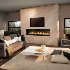 a living room with couches and a fireplace