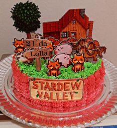 there is a cake decorated with farm animals on the plate and nameplates that read 2 rda lollala, stardew valley