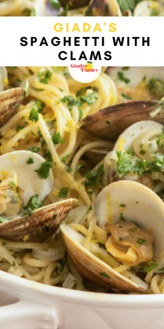 pasta with clams and parsley in a white bowl