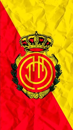 a red and yellow flag with a crown on top