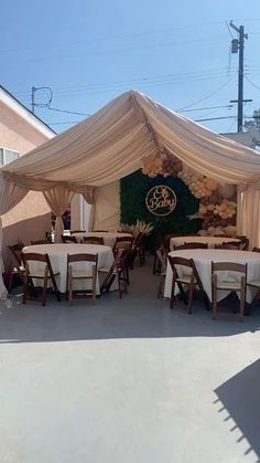 a large tent set up with tables and chairs