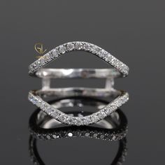 an open diamond ring on a reflective surface