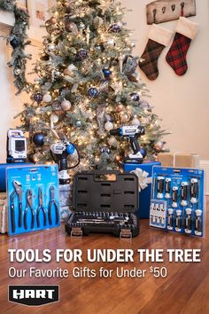 a christmas tree with tools for under the tree