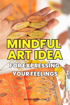 a hand holding some paper with writing on it and the words mindful art idea for expressing your feelings