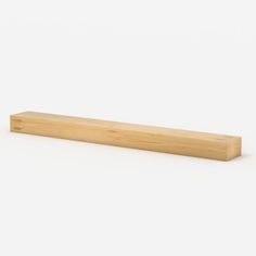 a piece of wood sitting on top of a white surface