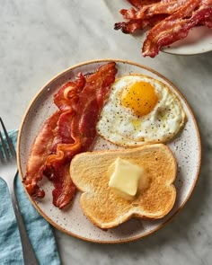 bacon, eggs and toast on a plate