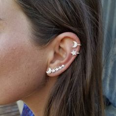 a close up of a person with ear piercings