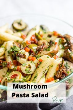 mushroom pasta salad in a glass bowl on a table