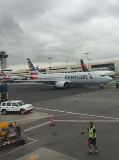 an american airlines plane is parked at the airport