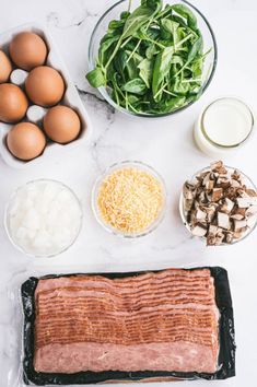 the ingredients to make this dish include eggs, spinach, mushrooms, cheese and bacon