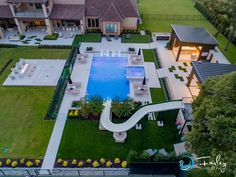 an aerial view of a house with a pool