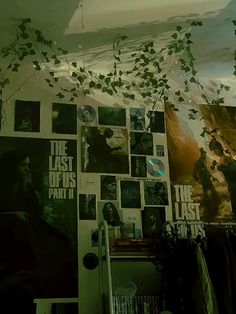 a room with posters and plants hanging from the ceiling