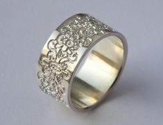 a wedding ring with an intricate design on it