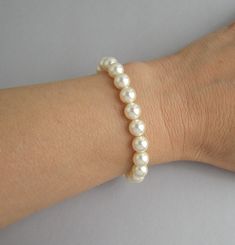 CB164: Swarovski pearl bracelet is available in about 6.5 inches (16.5cm) 7 inches (18cm) and 7.5 inches (19cm) long and it has about 1.5 inches (4cm) long extension. Please select the length for bracelet that you need. If you need a different length please let us know. Sizing, adjustments are available at no extra charge. The bracelet is available with 8mm and 6mm pearls. Please select the pearl size as well Materials and sizes: Swarovski pearls are made in Austria. Pearl size: 8mm or 6mm Pearl Cream Beaded Bracelets For Wedding With Round Beads, Cream Beaded Bracelets With Round Beads For Wedding, Cream Pearl Bracelet With Round Beads For Wedding, Cream Pearl Bracelet For Wedding, Handmade Elegant Gold-plated Pearl Bracelet, Adjustable Gold-plated Pearl Bracelet For Formal Occasions, Adjustable Gold-plated Pearl Bracelet For Weddings, Adjustable Yellow Gold-plated Pearl Bracelet, Swarovski Pearls Bracelet