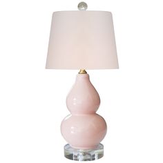 a pink lamp with a white shade on it