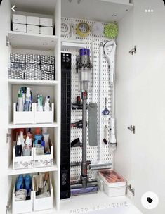 a white closet filled with lots of different types of bathroom accessories and items in it