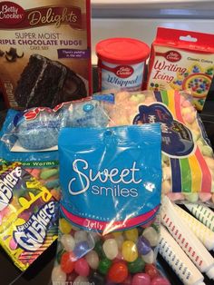 some candy and sweets are sitting on the counter