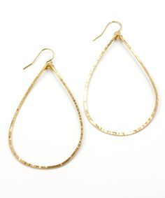 "Hammered and formed by hand, our Olivia Teardrop Earrings come with extra shimmer and in a size for everyone. This large 2.5\" size is one of Heather's Top Picks that everyone should own - they are lightweight, sturdy for travel, and a modern update to the basic hoop. To ensure the longevity of this design, all elements are made from high quality 14k Gold Filled or Sterling Silver wire that is hypoallergenic and will not flake, discolor or wear off over time. Looking for a different size? The O Handmade Teardrop Yellow Gold Hoop Earrings, Tarnish Resistant Teardrop Hoop Earrings, Yellow Gold Teardrop Hoop Earrings With Ear Wire, Everyday Hand Forged Teardrop Hoop Earrings, Hand-forged Teardrop Hoop Earrings, Gold Teardrop Earrings, Indigo Design, Boho Hoop Earrings, Board Room