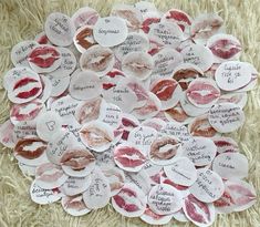 a pile of paper hearts with different types of kisses on them