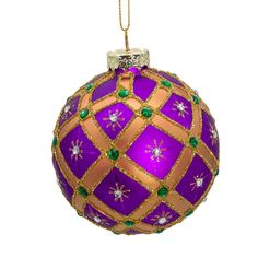 a purple and gold christmas ornament hanging from a string