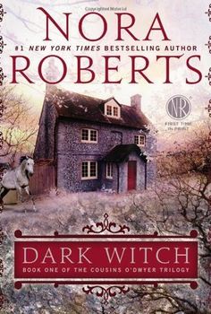 the cover of dark witch by nora roberts, with an image of a house in the background