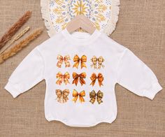 Autumn Girly Baby Romper Sweatshirt, Coquette Pumpkin Baby Romper, Fall Vibes, Pumpkin Patch Baby Bodysuit, Newborn Outfit - Handmade     - Ships from USA     - Materials: 100% CPSIA Compliant and Ethically Made material   Light fabric (5.0 oz/yd² (170 g/m    Crafted with soft, breathable fabric, this romper ensures your baby stays comfortable through playtimes and nap times alike. Featuring charming designs suitable for all babies, our romper is as adorable as it is practical.     Quick Sizing White Long Sleeve Onesie Gift, Coquette Pumpkin, Romper Fall, Nap Times, M Craft, Pumpkin Baby, Newborn Outfit, Baby In Pumpkin, Miami Fl